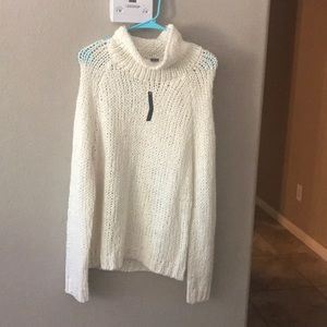 Chelsea & Theodore white sweater.